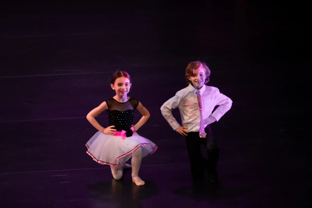 Two kids in a ballet class performance