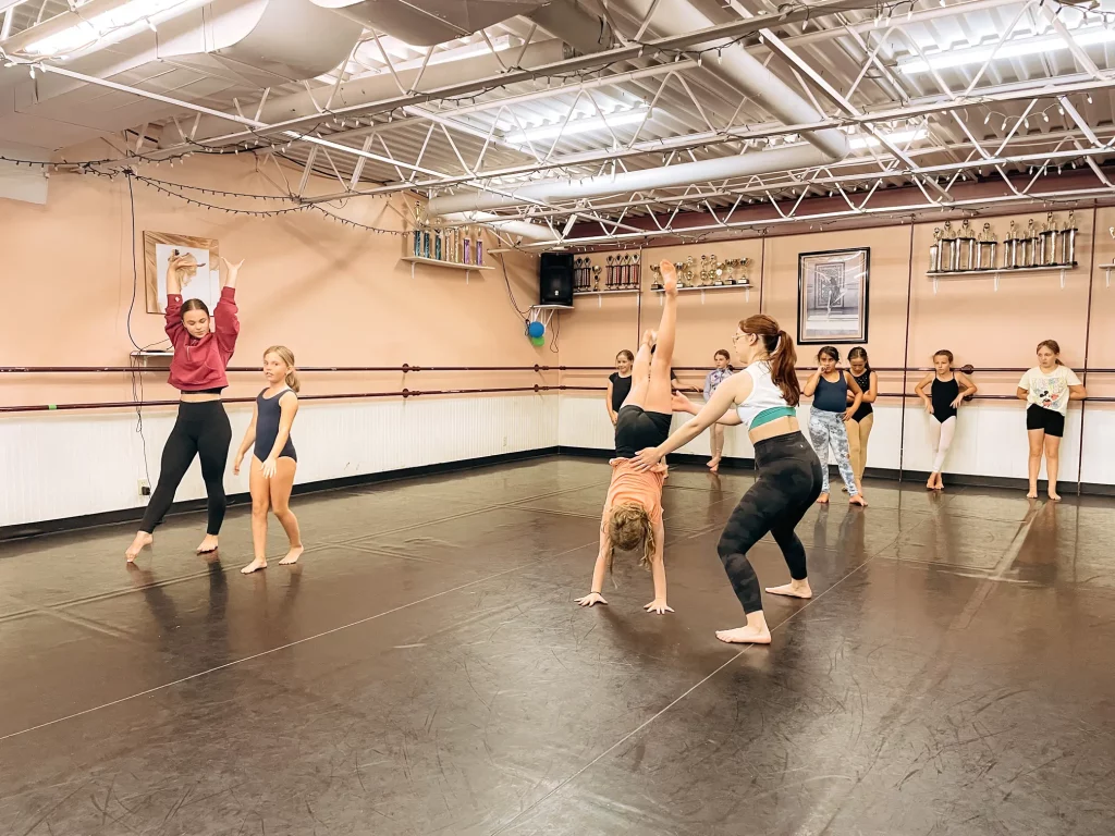 Students practicing in an acro dance class