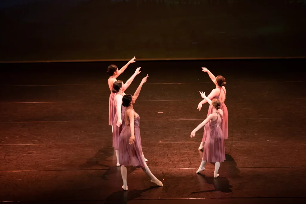 Students performing in a ballet class